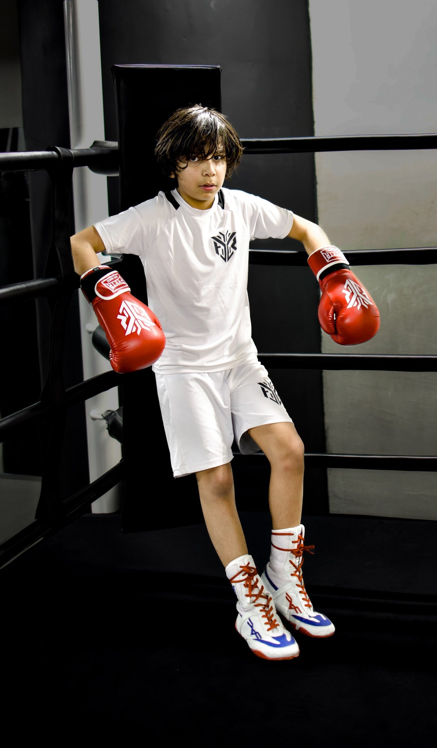 A boxer in headguard between rounds