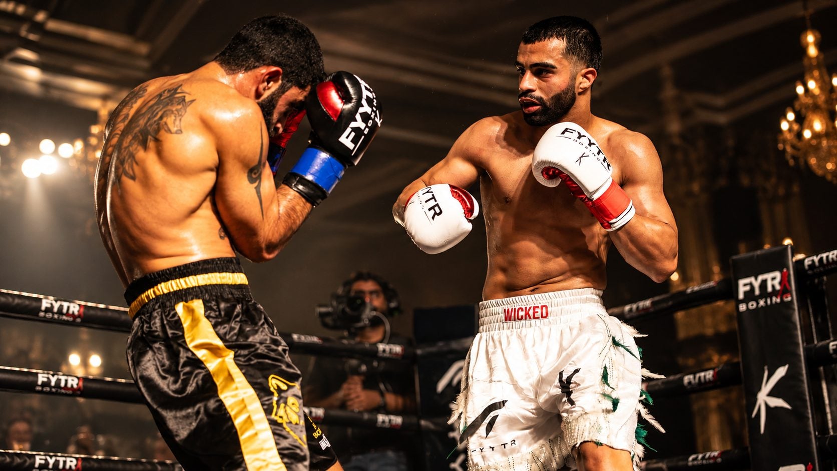 Two boxers mid-bout under ring lights, one in white FYYTR gloves