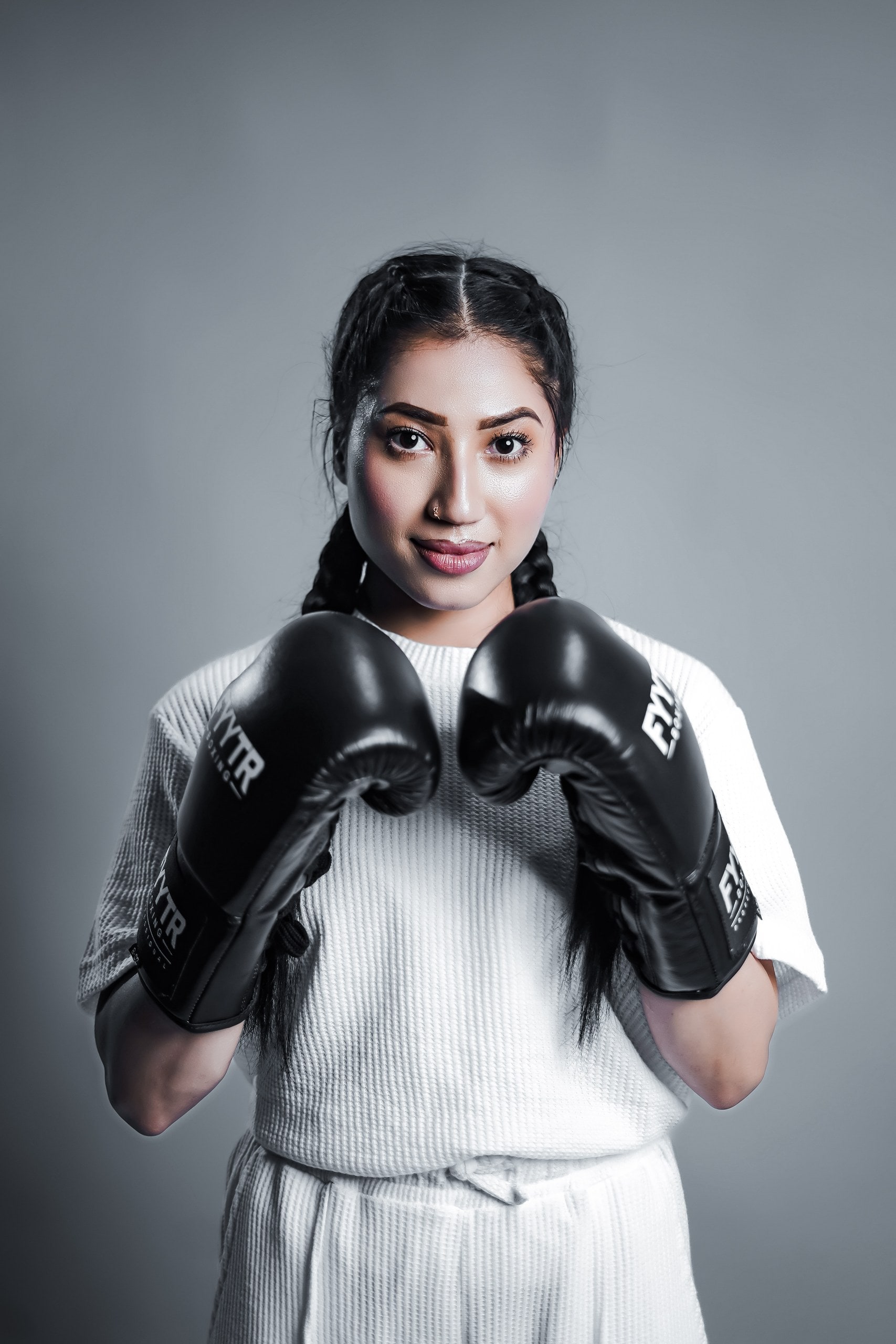 A boxer in training gloves and wraps