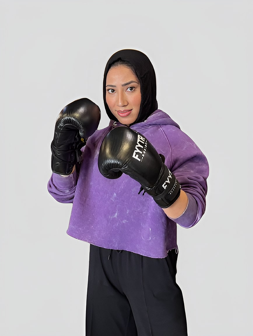Abida Batool with her guard up in black FYYTR gloves