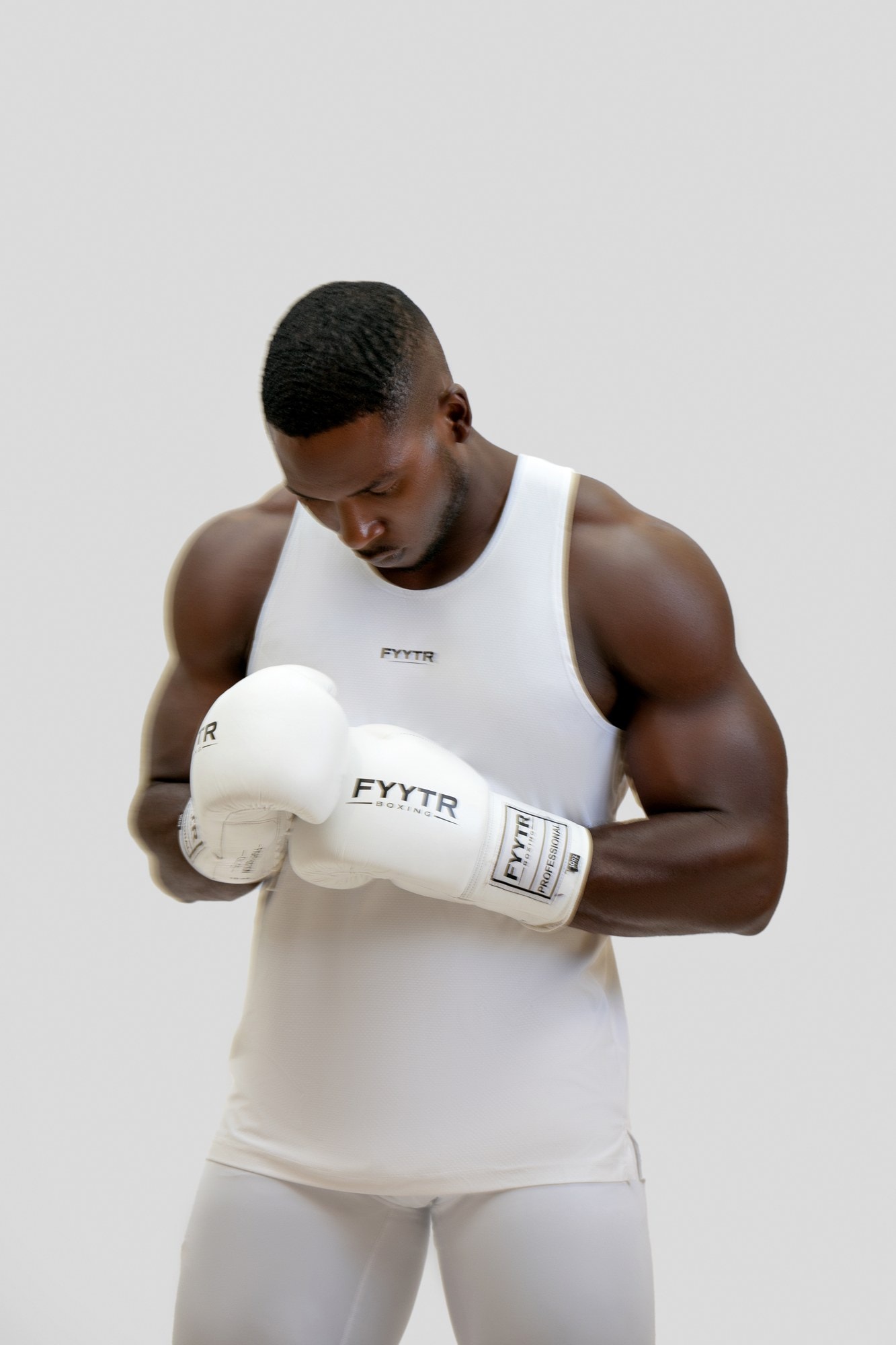 Two pairs of boxing gloves side by side