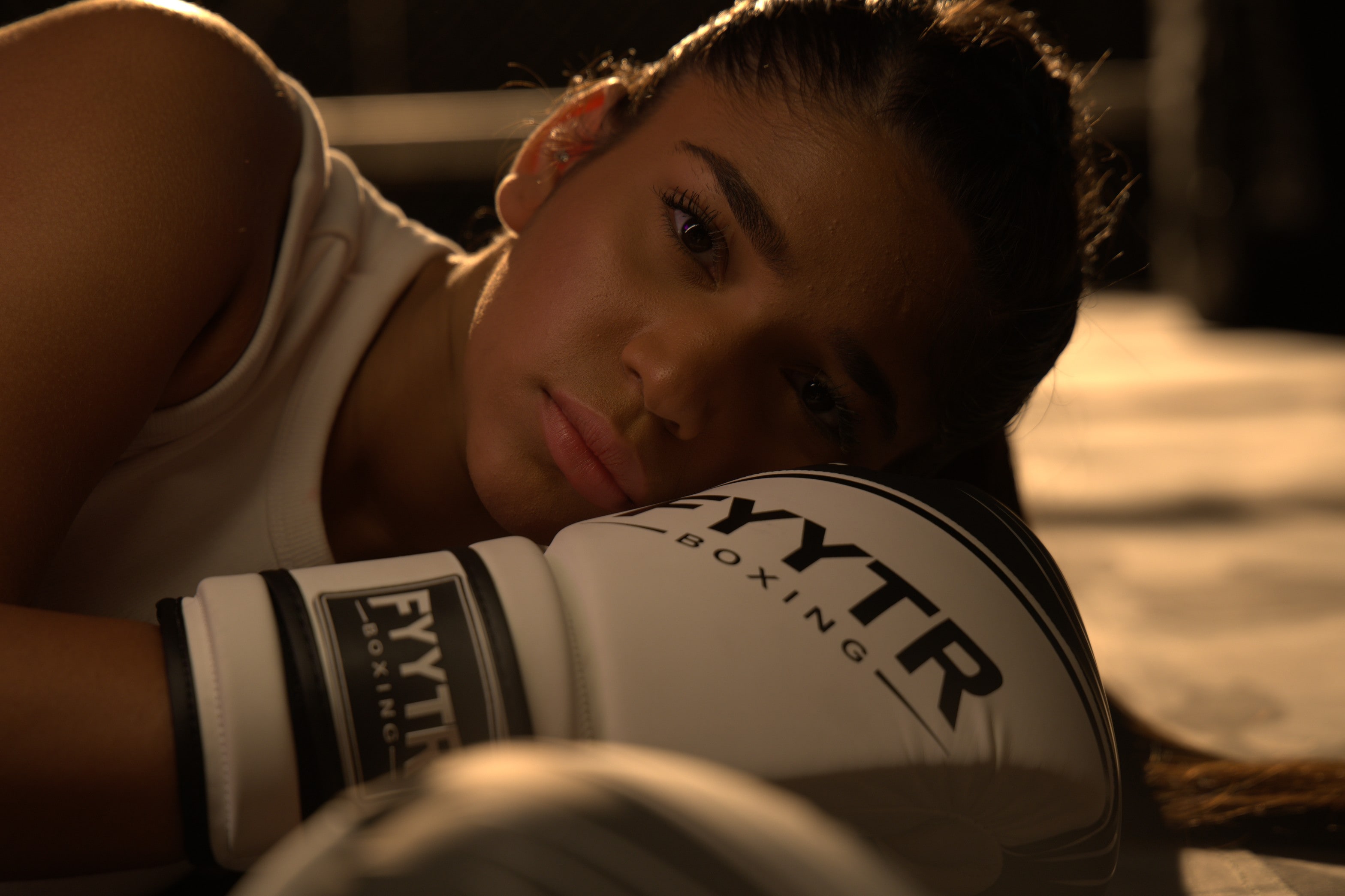 A beginner working the pads in a UAE gym