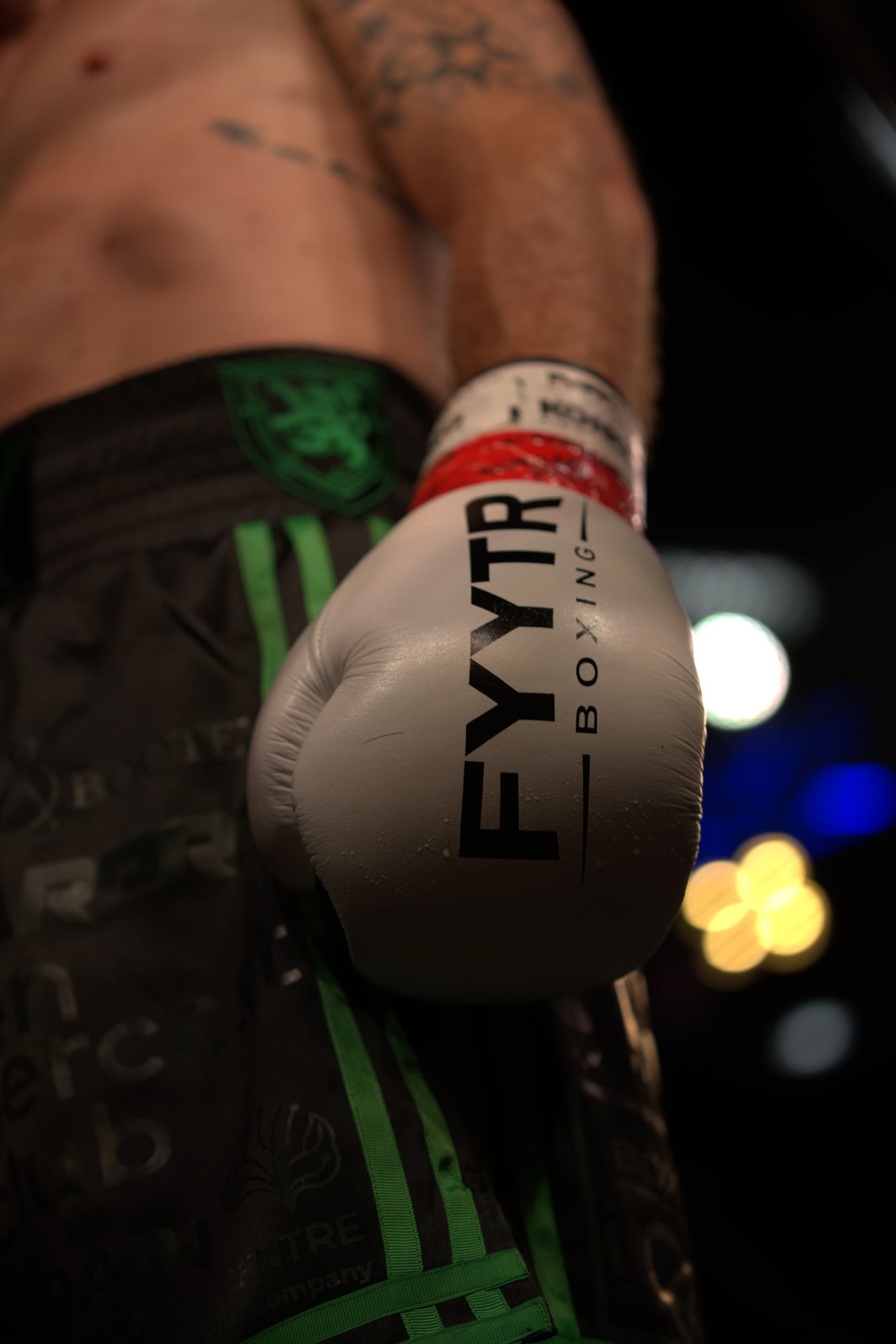 A pair of white FYYTR boxing gloves